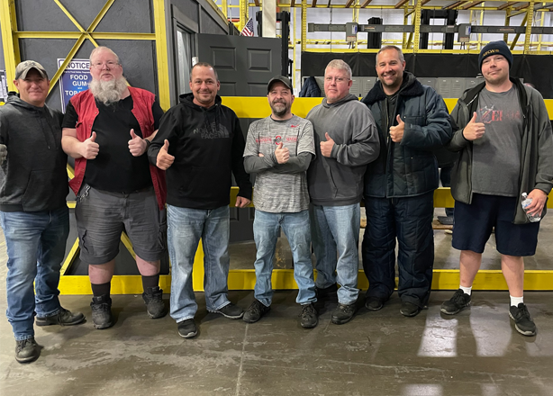 Smiling workers at Save A Lot Distribution Center stand in a row, represented by UFCW Local 880